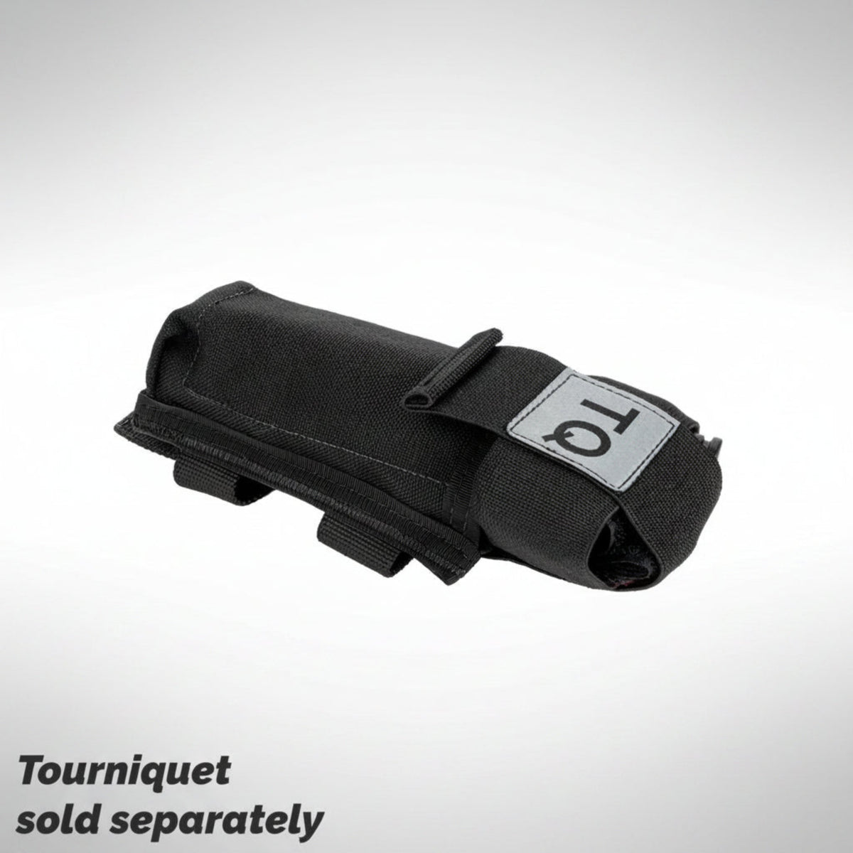 Black tourniquet holder with 'TQ' label on a gray background