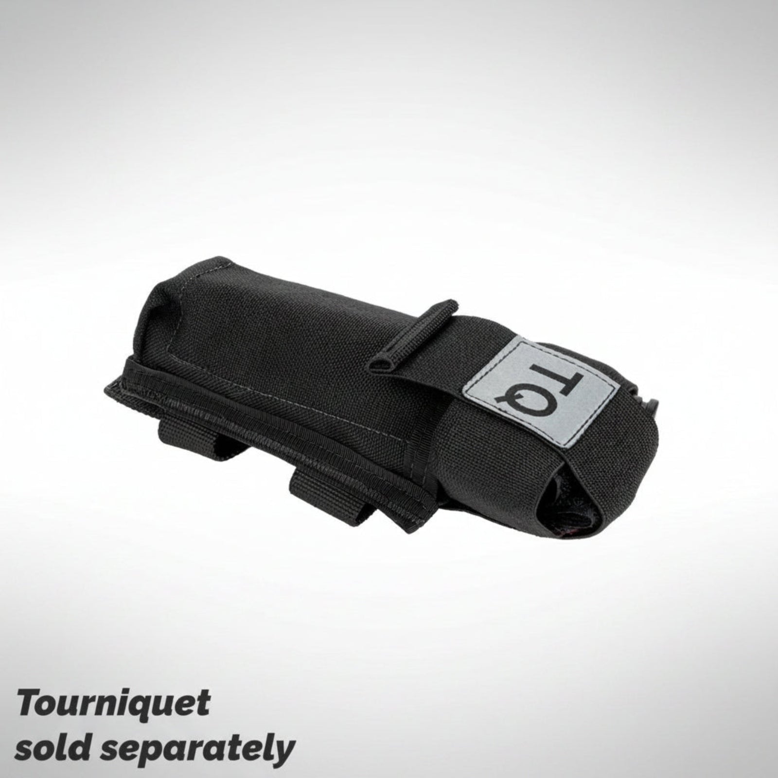 Black tourniquet holder with 'TQ' label on a gray background