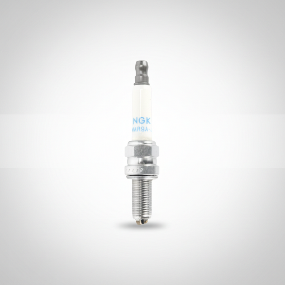 Spark plug with NGK branding on a white background