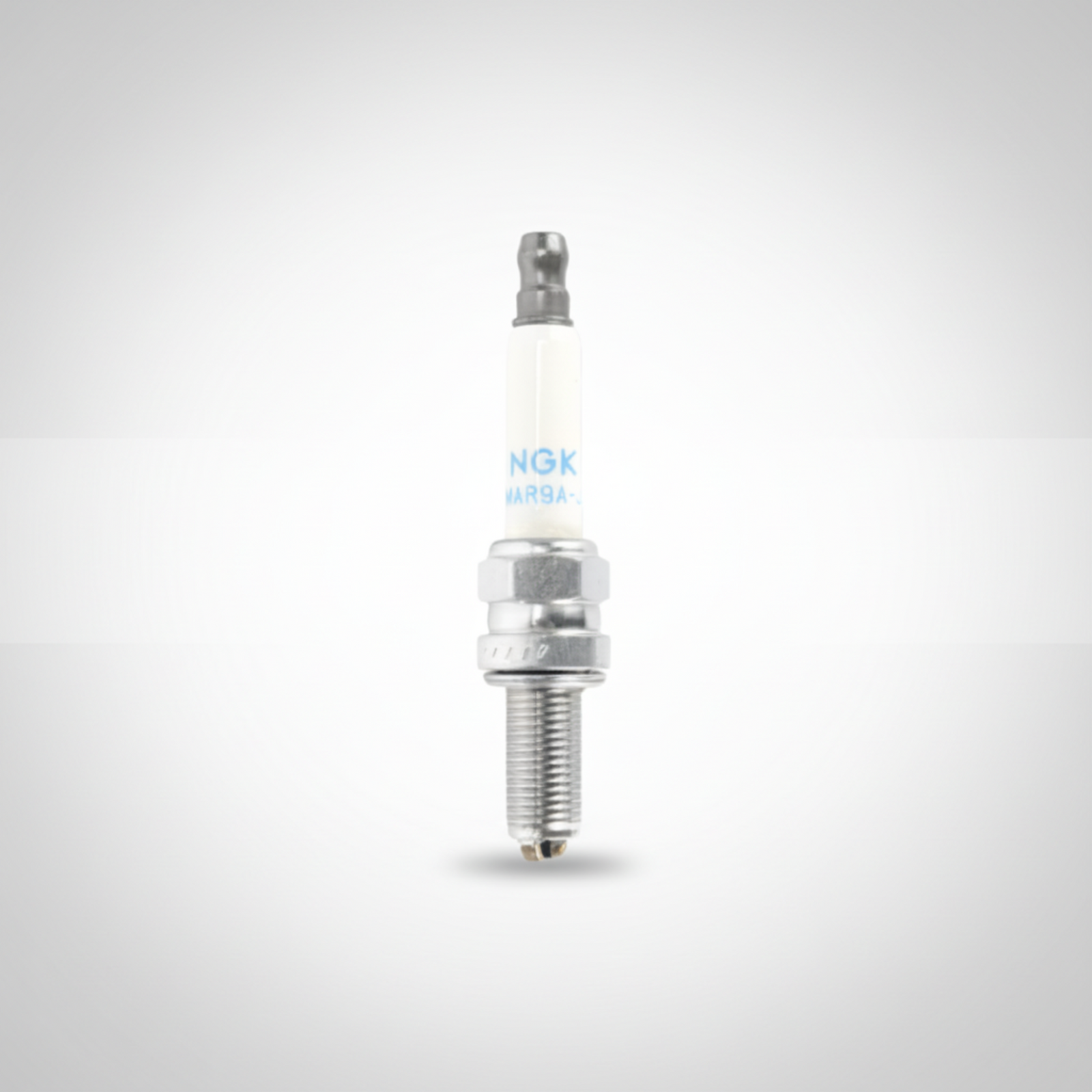 Spark plug with NGK branding on a white background