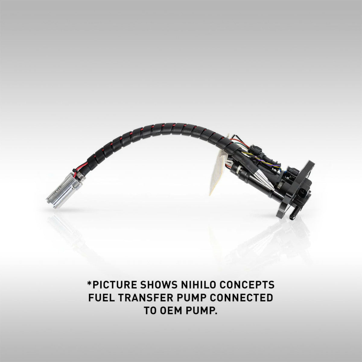Nihilo Concepts fuel transfer pump connected to OEM pump on a gray background