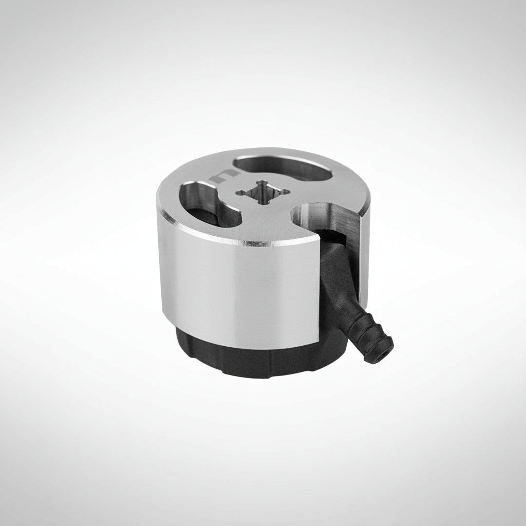 Nihilo Concpets billet radiator cap removal tool on a gray background