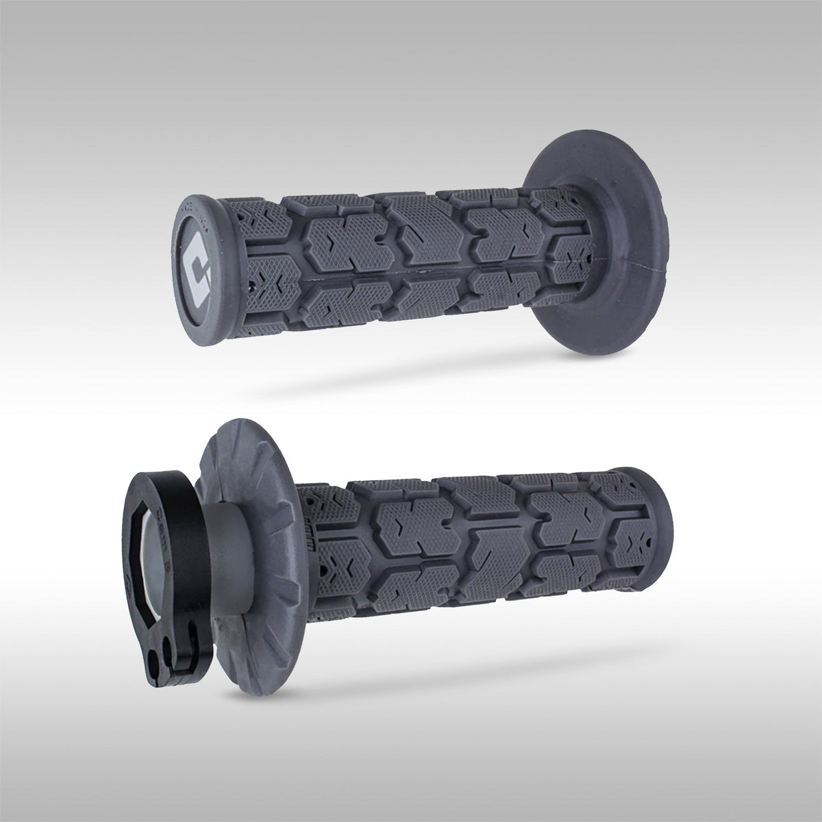 A pair of Graphite ODI V2 Lock-On Rogue Moto Grips on a gray background