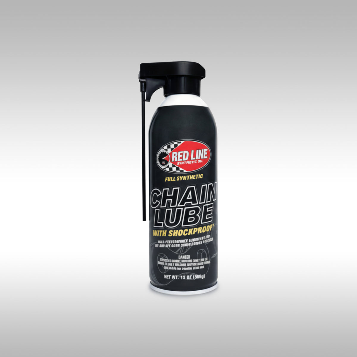 Red Line chain lube spray can on a gray background