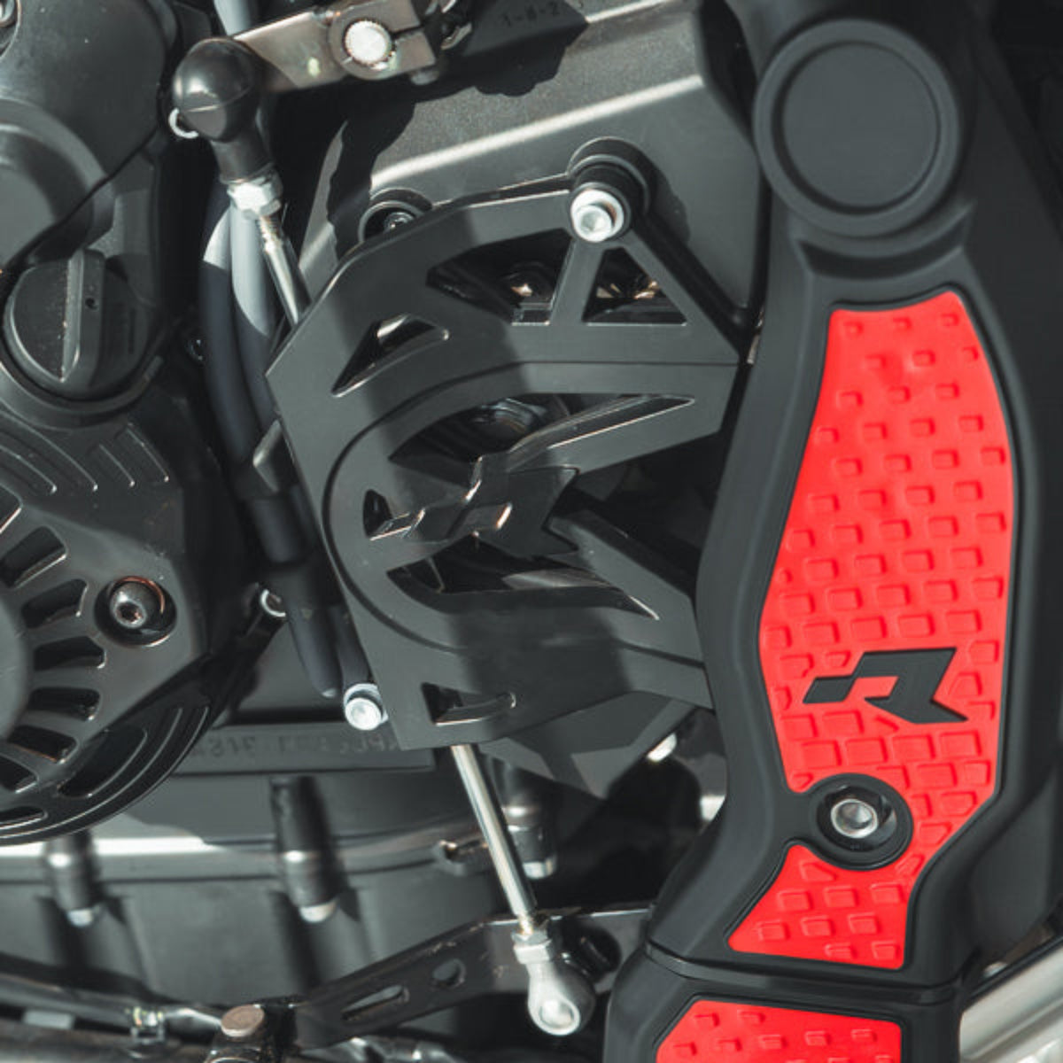 Close-up of a Tenere 700 Shift Rod Protector installed.