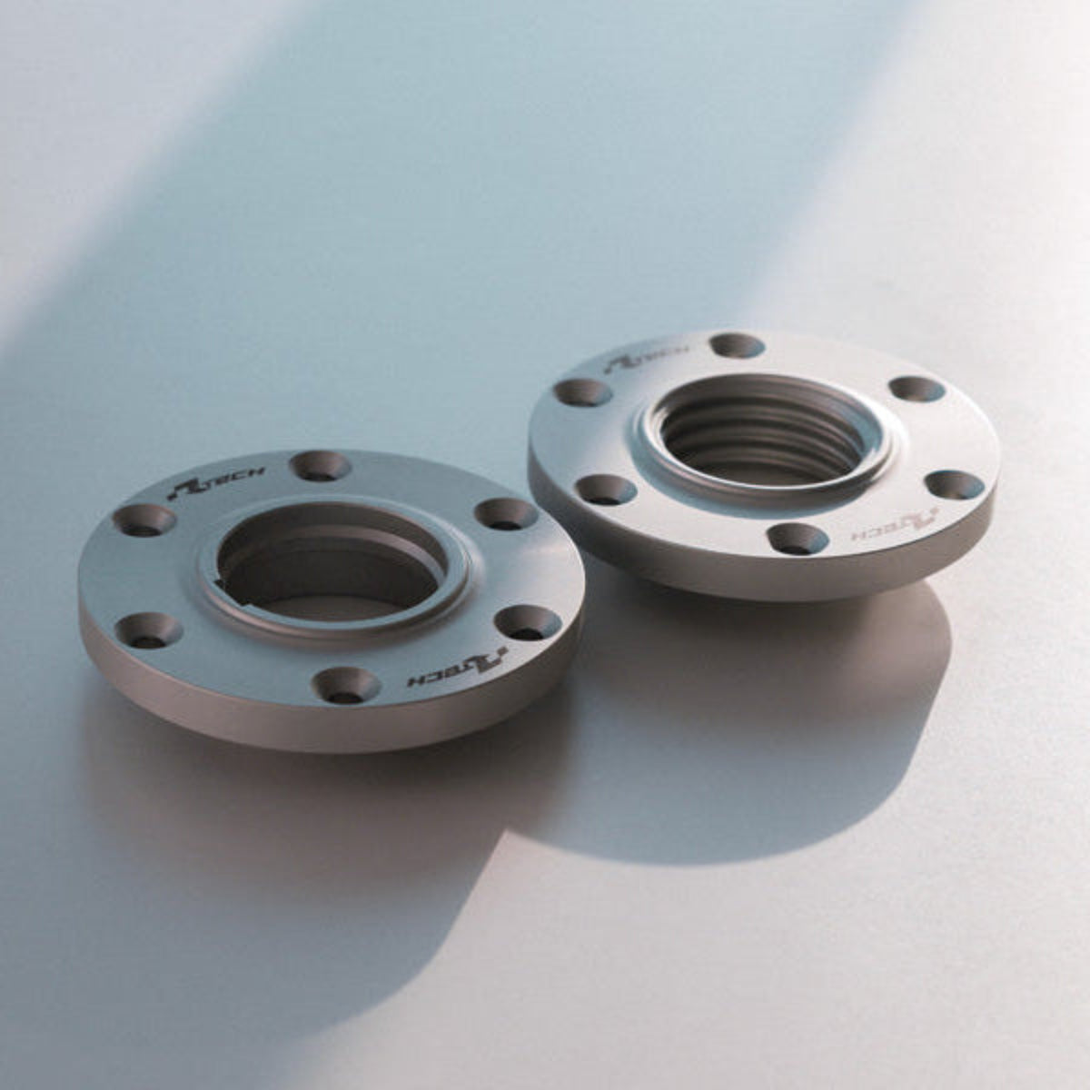 Two metal flanges for RTech Tenere 700 fuel tank on a light gray background