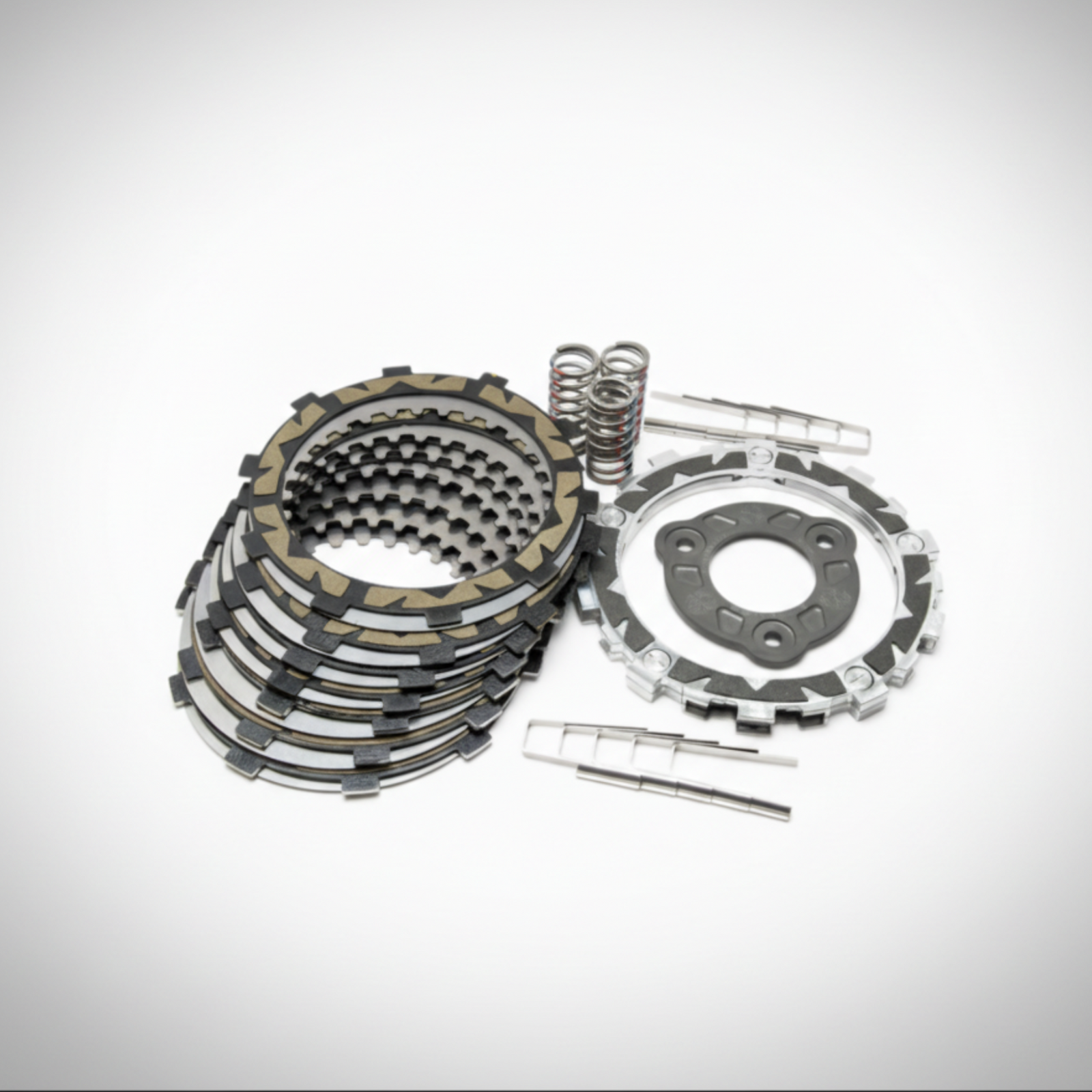 Clutch kit with multiple plates, springs, and a cover on a white background