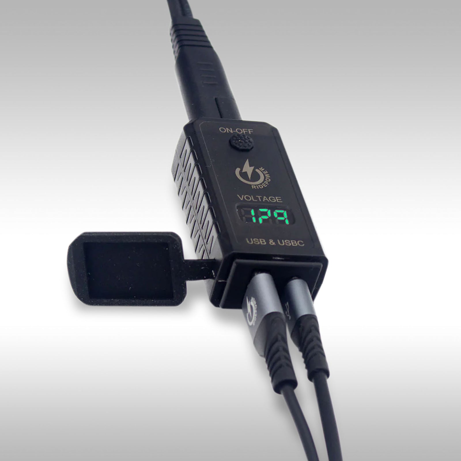 RidePower SAE To USB-A USB-C Outlet With Voltage Display on gray background