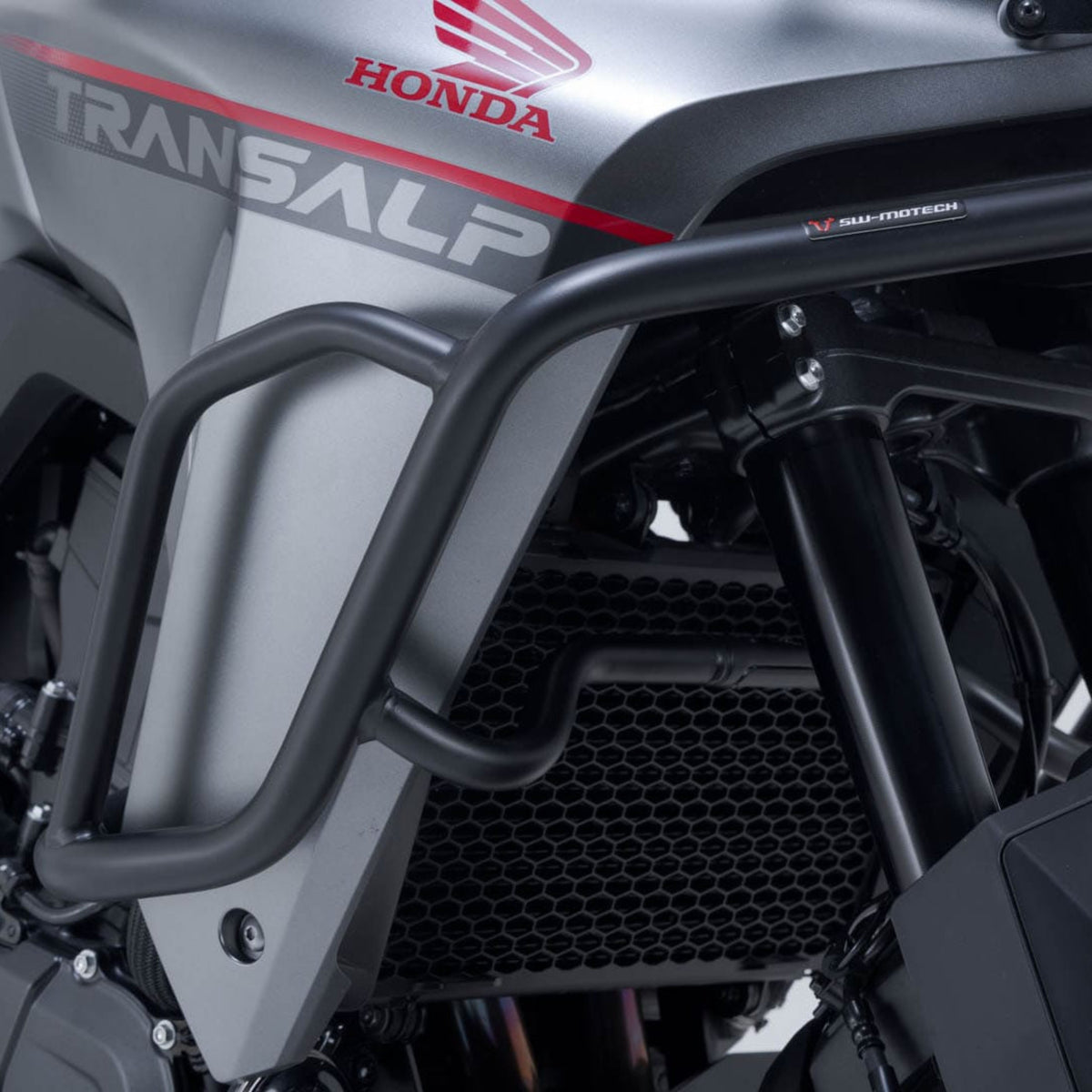 SW-MOTECH SBL.01.070.10002/B black steel crash bars mounted on a Honda XL750 Transalp adventure motorcycle.