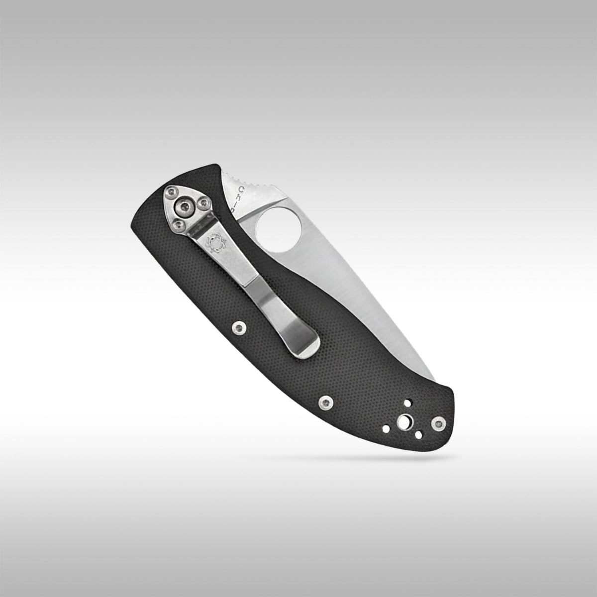 Spyderco Tenacious C122GP folding knife showing the full-flat grind blade and textured black G-10 handle.