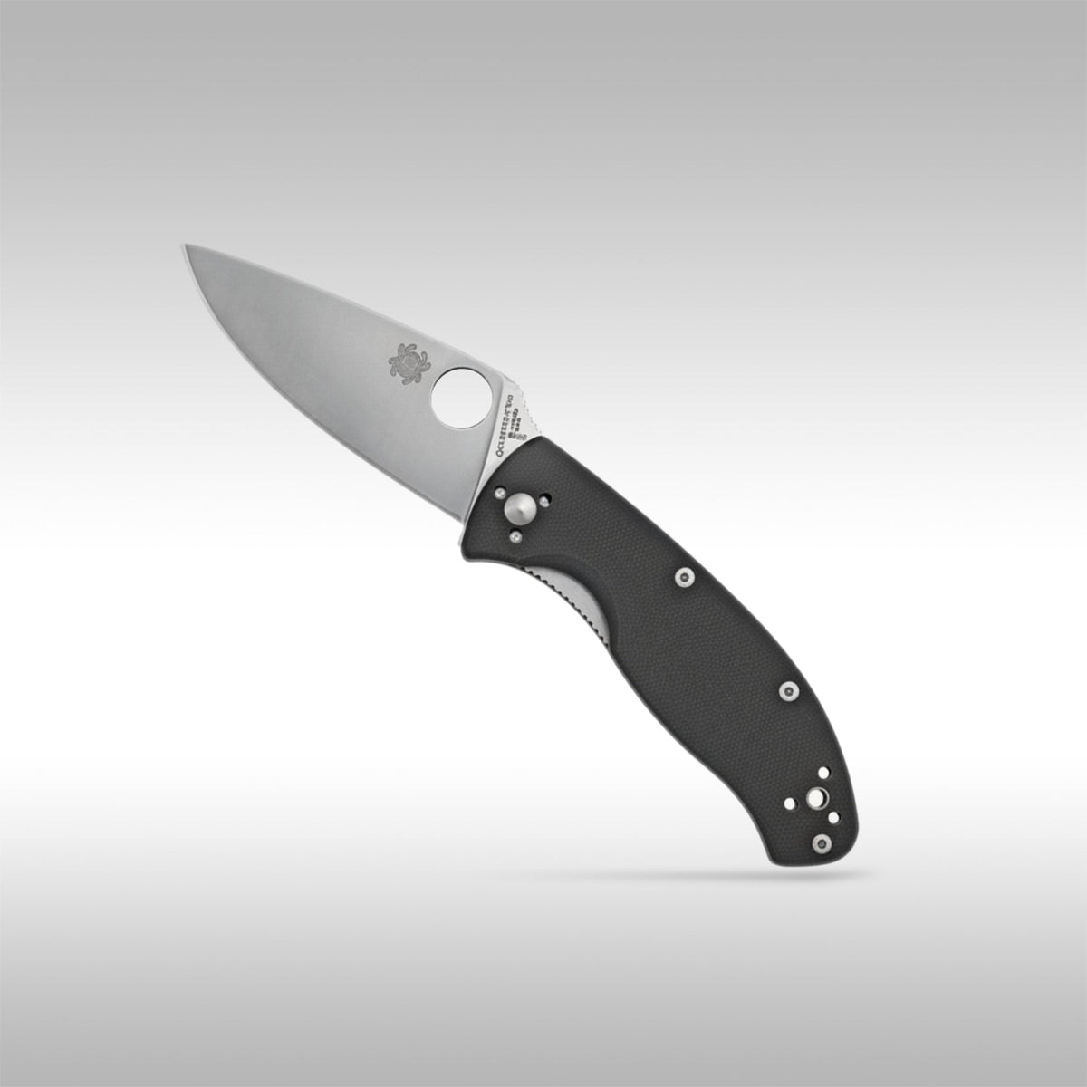 Spyderco Tenacious C122GP folding knife showing the full-flat grind blade and textured black G-10 handle.