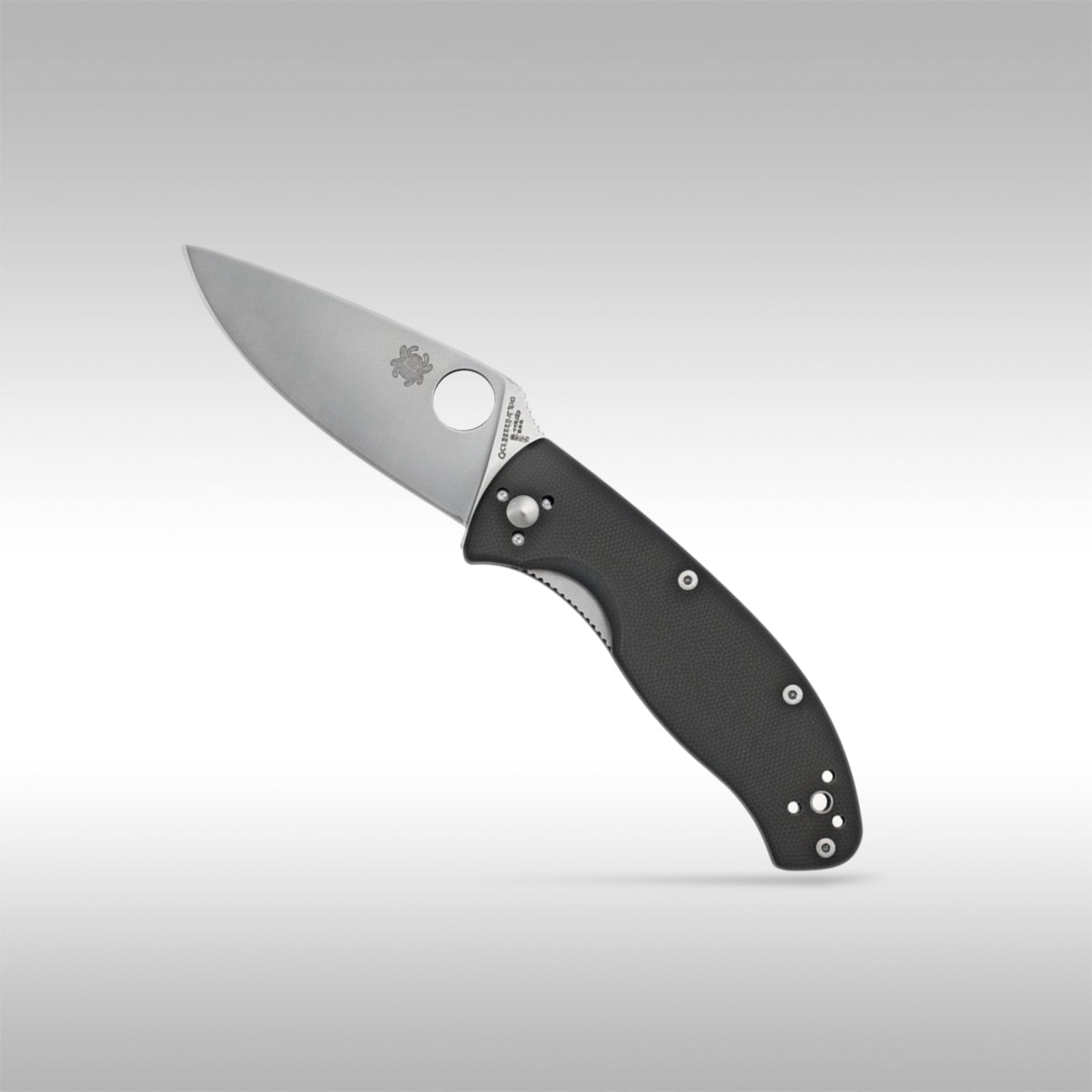 Spyderco Tenacious C122GP folding knife showing the full-flat grind blade and textured black G-10 handle.