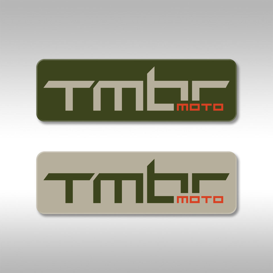 TMBR MOTO logo sticker. Matte finish, 4 mil vinyl in dark green with tan and tan with dark green. Sticker is oriented horizontally. 