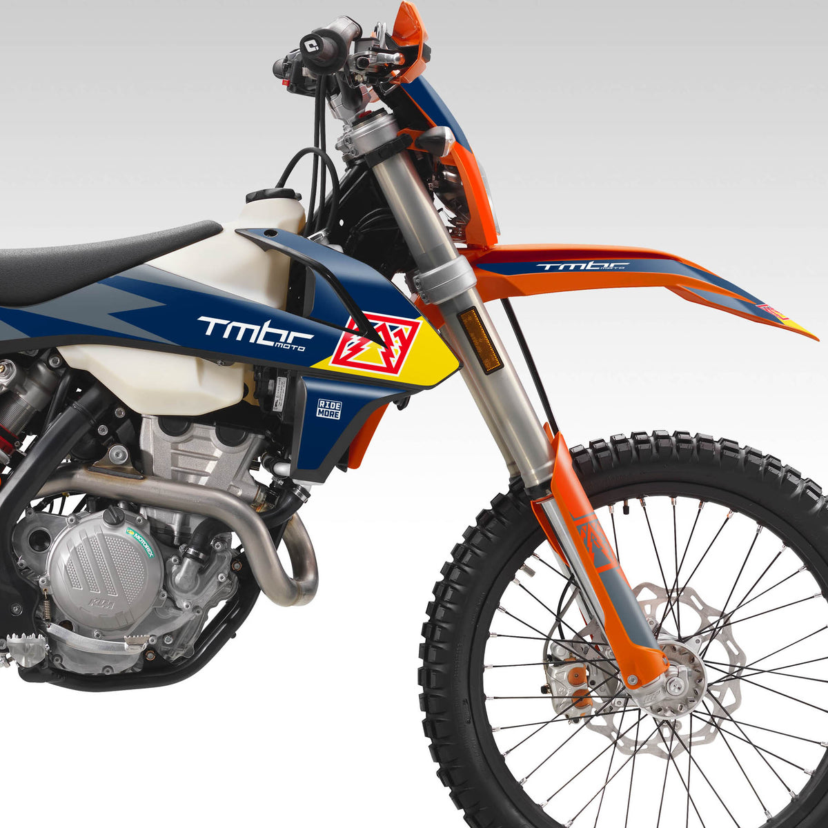 Close-up of a dirt bike with visible branding on a white background