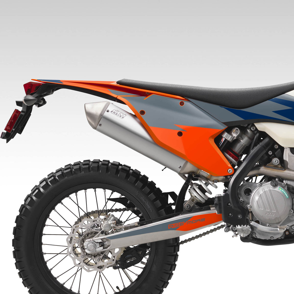 Side view of a dirt bike with orange and gray design on a white background