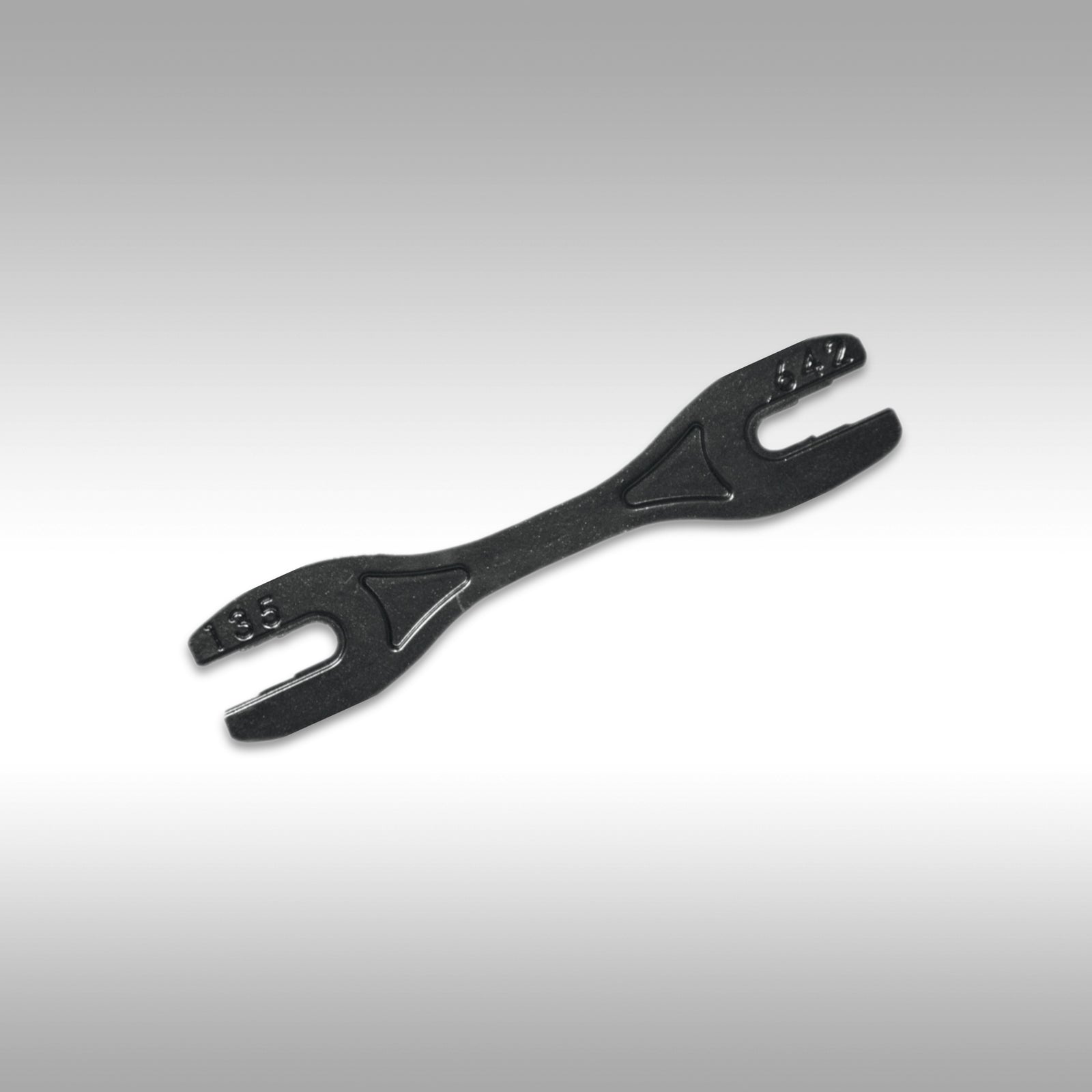 Black spoke wrench on a gray background