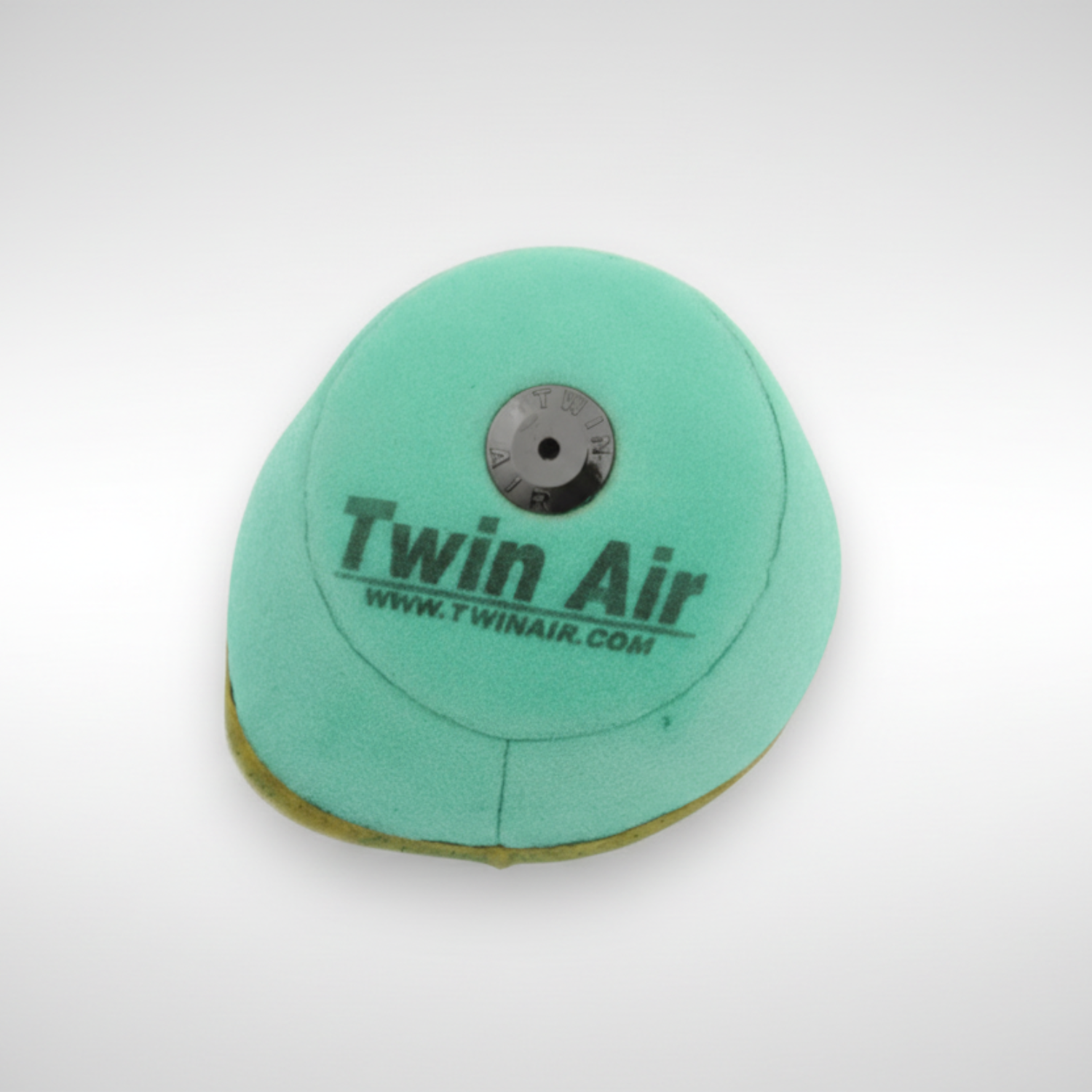 Green air filter with 'Twin Air' branding on a white background