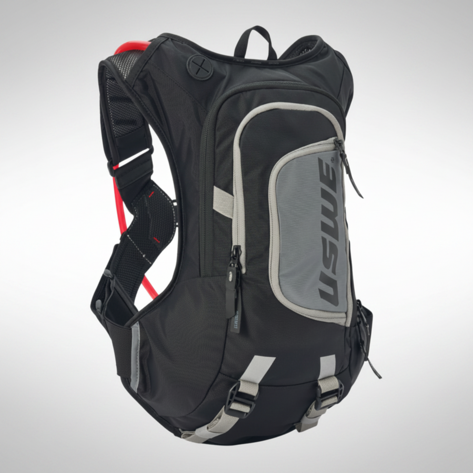 Black USWE moto hydration backpack with gray accents on a white background
