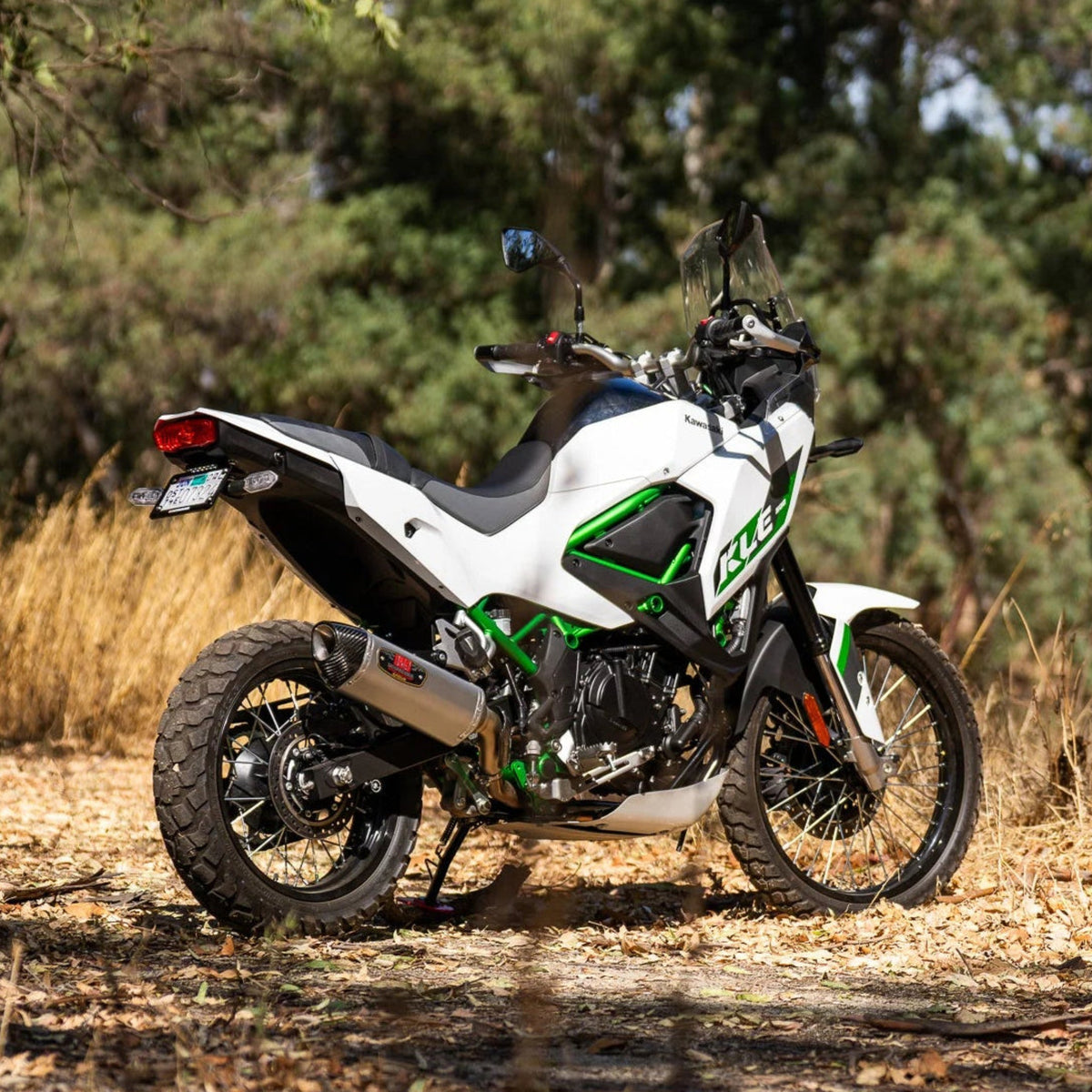 Yoshimura 14500B0520 R-77 stainless steel slip-on exhaust muffler with carbon fiber end cap mounted on a Kawasaki KLE500.