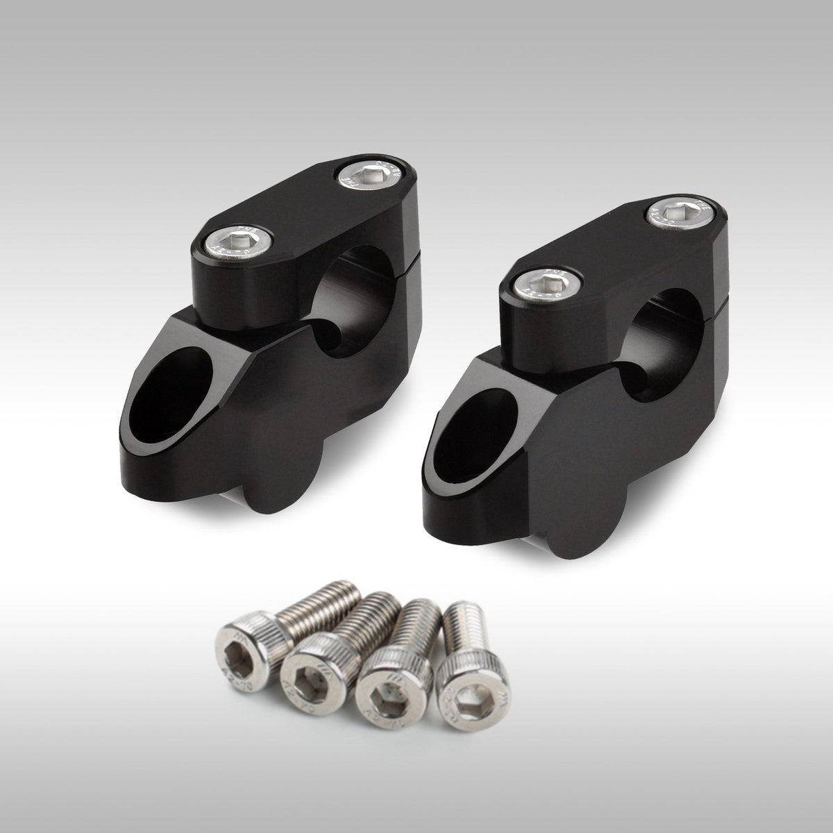 Zeta offset bar riser kit for motorcycle handlebars shown in CNC-machined aluminum.