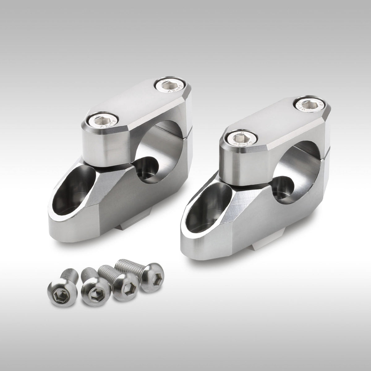 Zeta offset bar riser kit for motorcycle handlebars shown in CNC-machined aluminum.