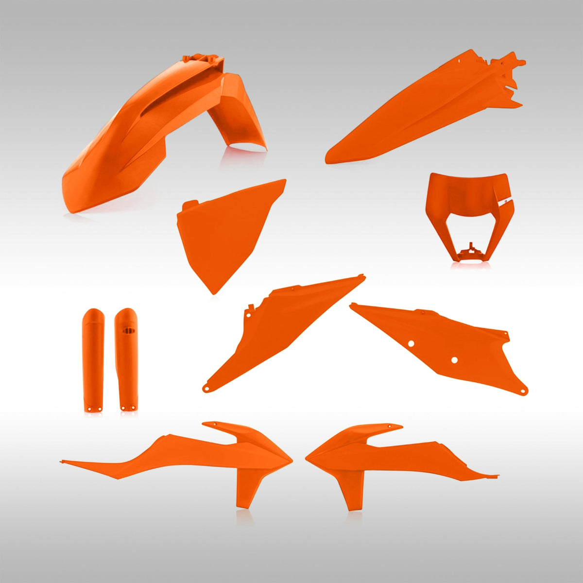 Orange motorcycle plastic parts on a gray background