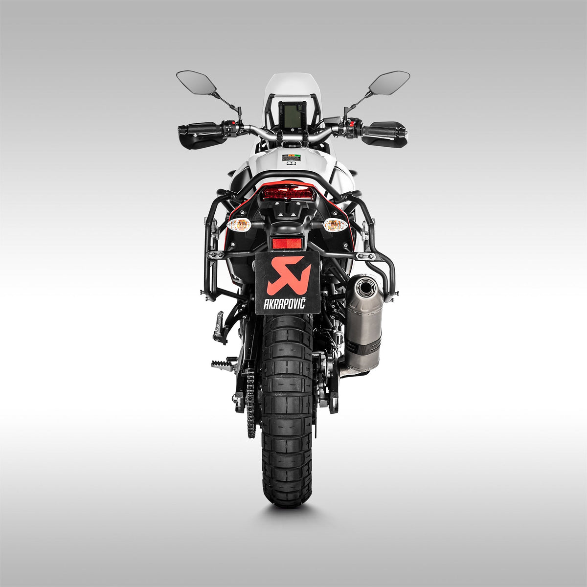 Rear view of the titanium Akrapovic off-road slip-on exhaust for the Yamaha Tenere 700.