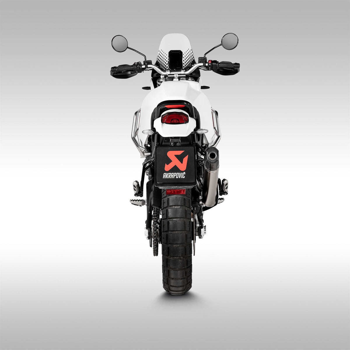 Akrapovic Titanium Slip-On Muffler for Ducati DesertX motorcycle. Installed on a machine.