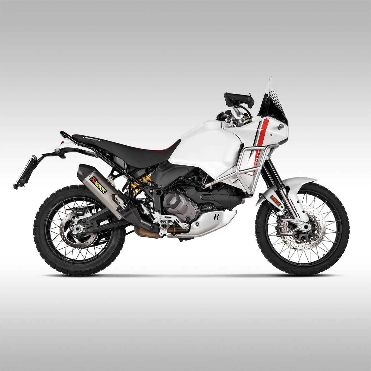 Akrapovic Titanium Slip-On Muffler for Ducati DesertX motorcycle. Installed on a machine. Side profile.