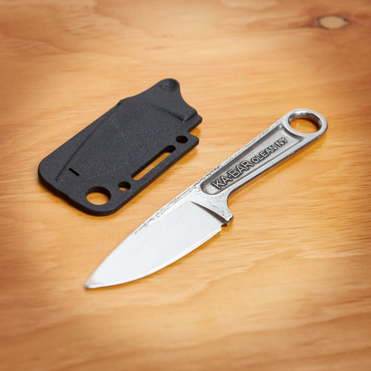 Ka-Bar 1119 Forged Wrench Knife drop-forged from 425 stainless steel, shown with included hard plastic sheath.