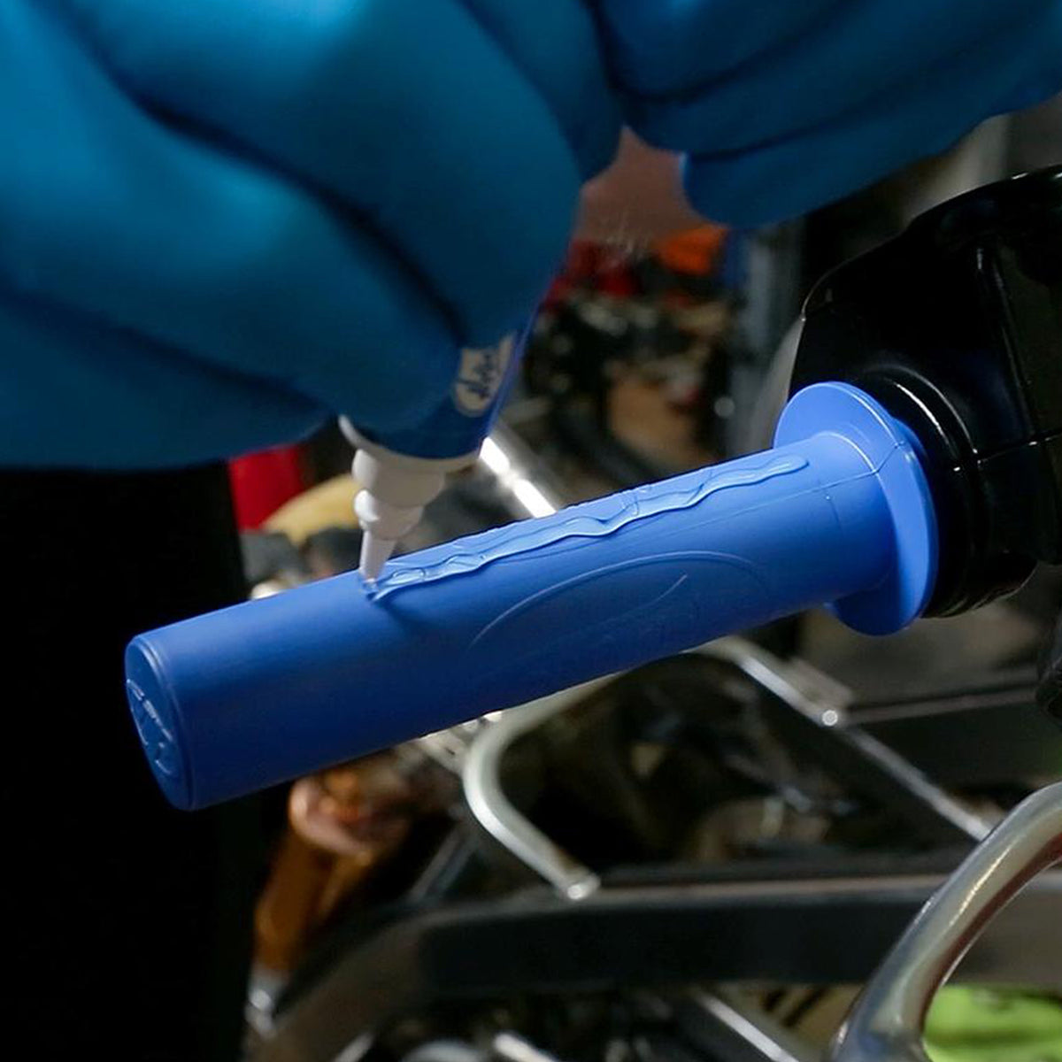 Showing the Motion Pro grip glue being applied. Motion Pro grip glue for securing motorcycle grips to your handle bars and throttle tube. Multipurpose adhesive formulated for ease of use and great durability. 
