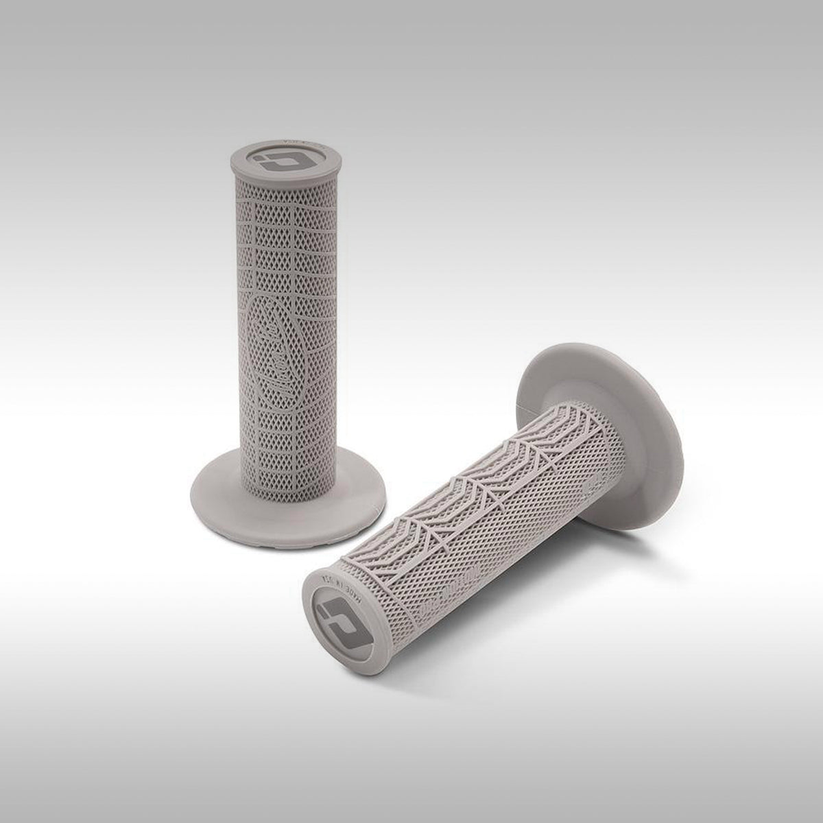 A pair of gray Motion Pro DirtControl II glue-on motorcycle grips featuring a geometric pattern.