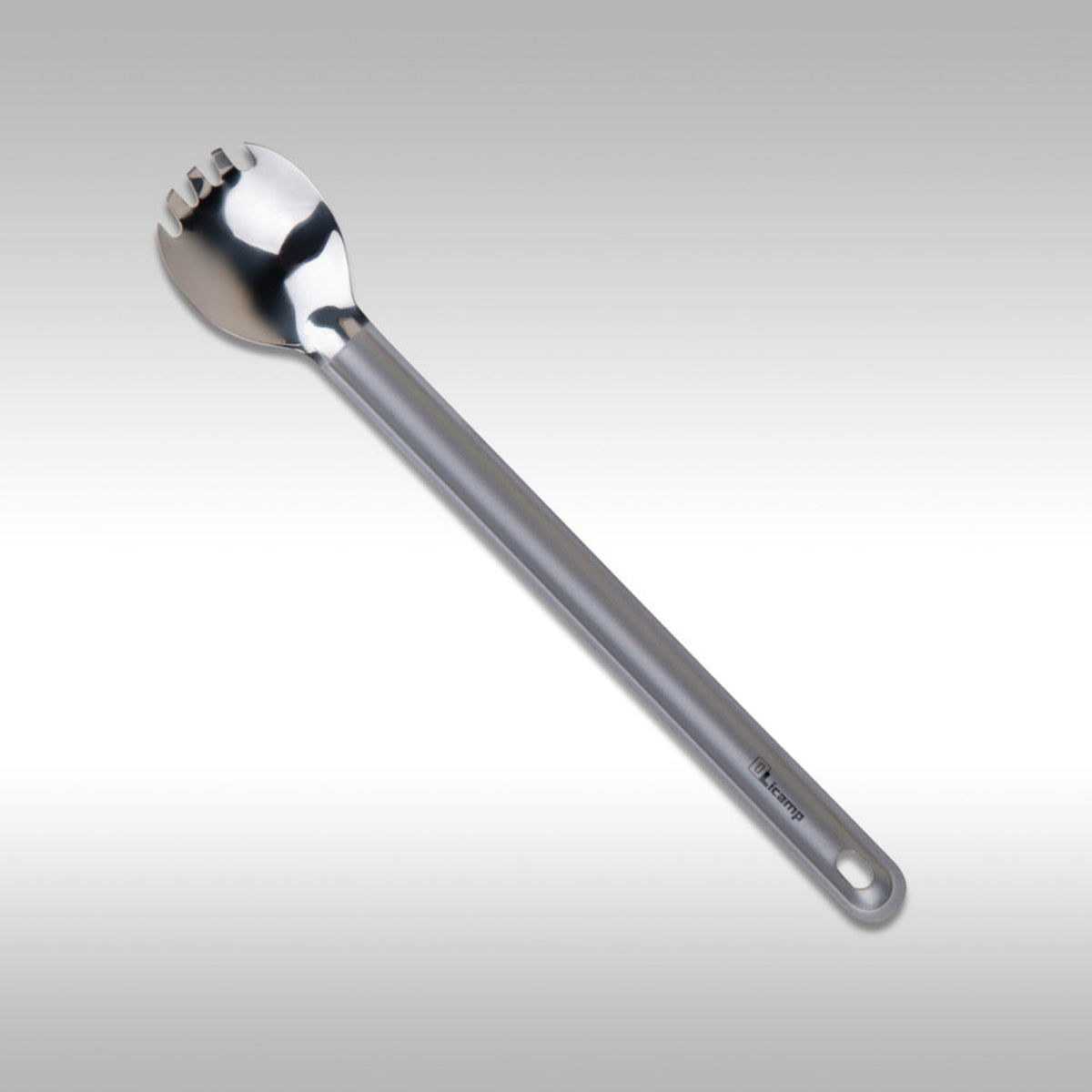 Olicamp Titanium Spork camping utensil on light gray background
