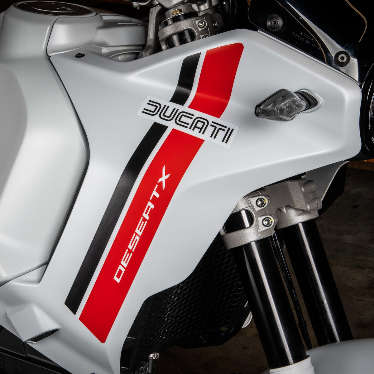 Ducati motorcycle with Retro Red styling kit on a gray background