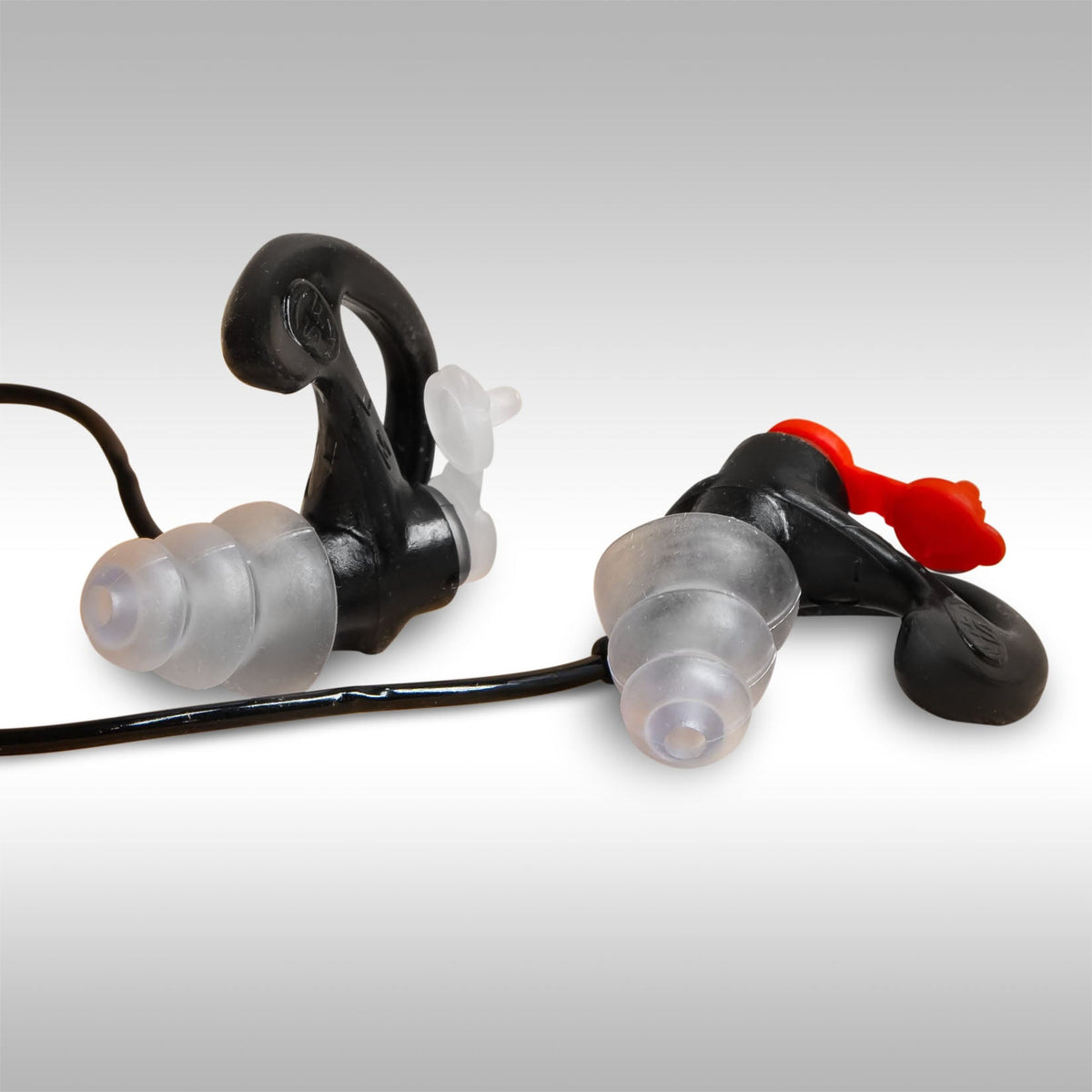 SureFire earplugs with a black carrying case on a light gray background