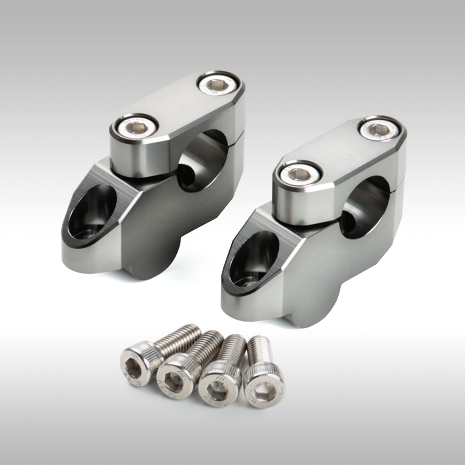 Zeta offset bar riser kit for motorcycle handlebars shown in CNC-machined aluminum.