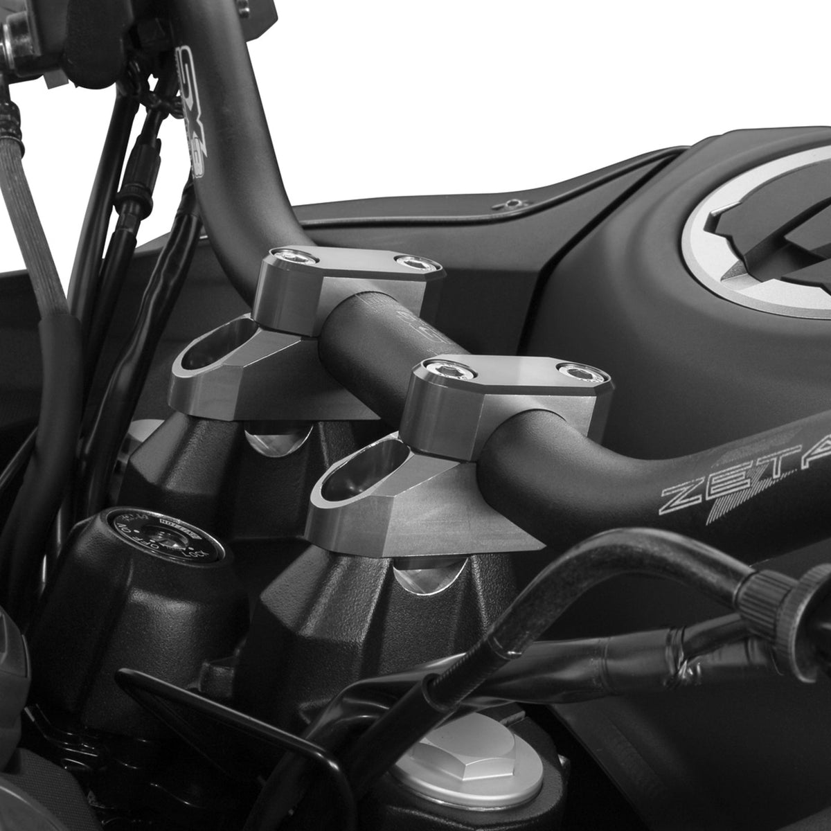 Zeta offset bar riser kit for motorcycle handlebars shown in CNC-machined aluminum.